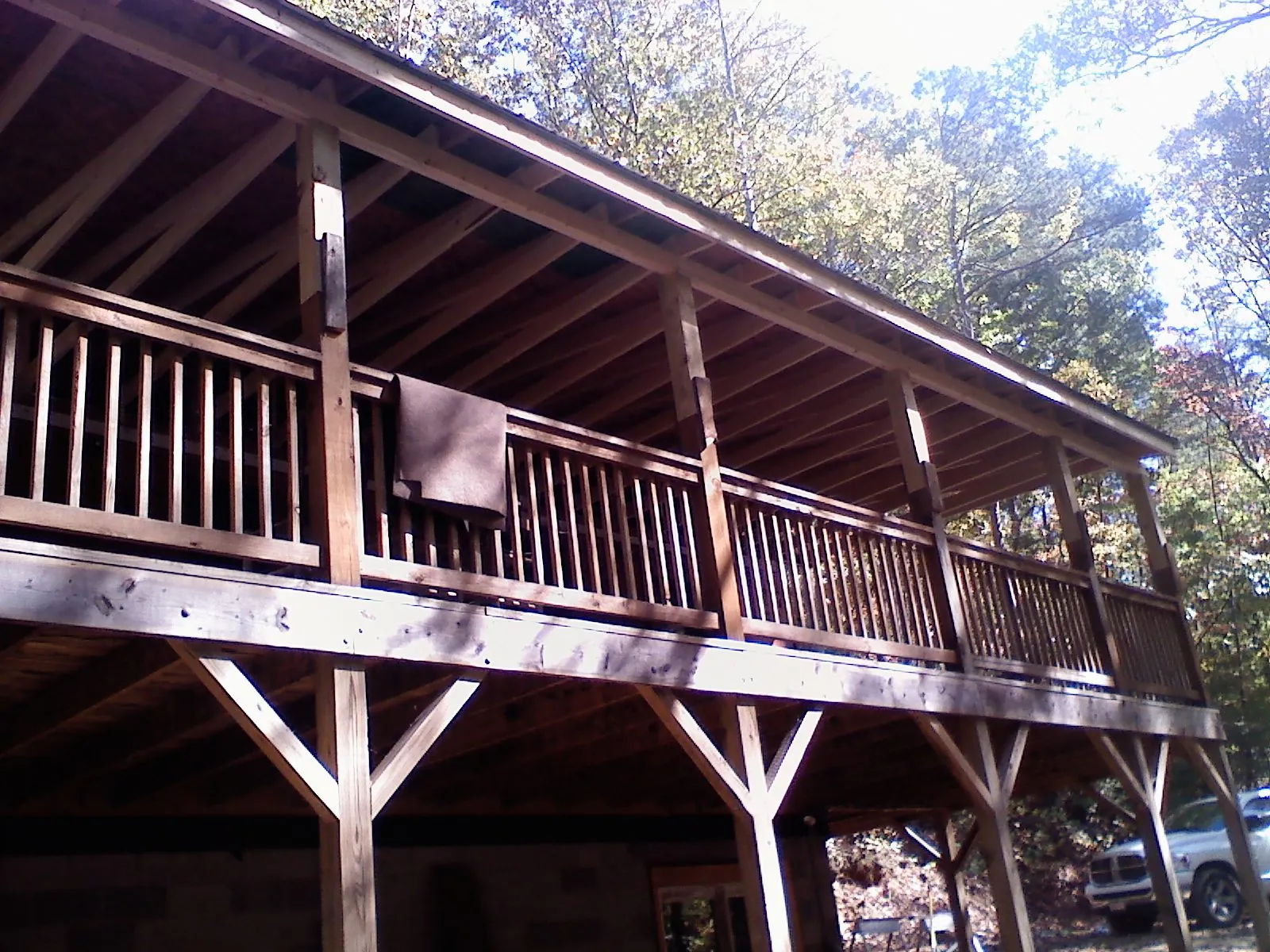 Timber framing under a new elevated porch and deck — Roof Leak Repair in Napoleon by Roofing Brothers